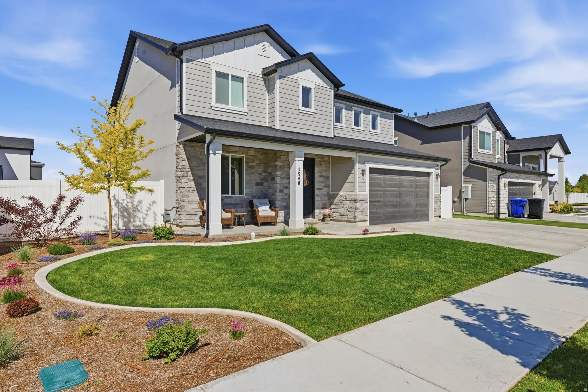 Beautiful Front View of the Home Fully Landscaped w/ Extra Parking Area