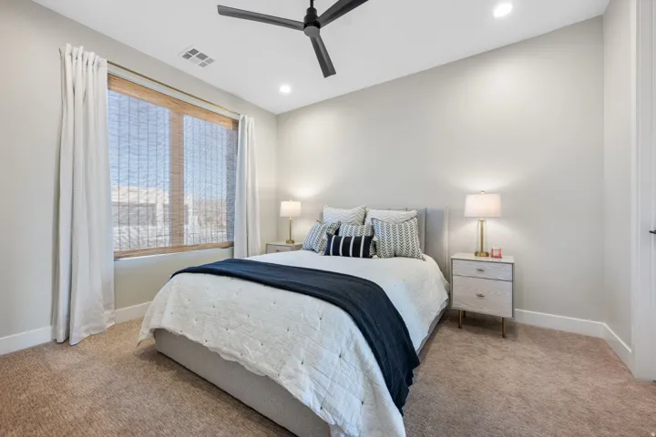 Bedroom featuring recessed lighting, a ceiling fan, and carpet floors