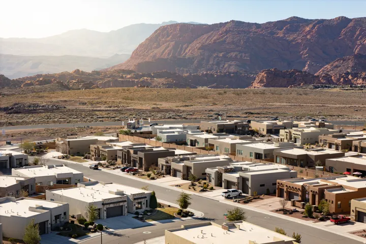 View of mountain backdrop featuring nearby suburban area