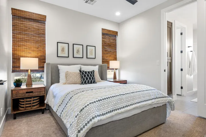 Bedroom with ceiling fan, light tile patterned flooring, and recessed lighting