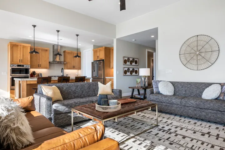 Living area with a ceiling fan and recessed lighting