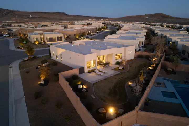 Aerial view of residential area featuring a mountainous background