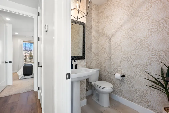 Half bathroom featuring recessed lighting and light wood-style floors