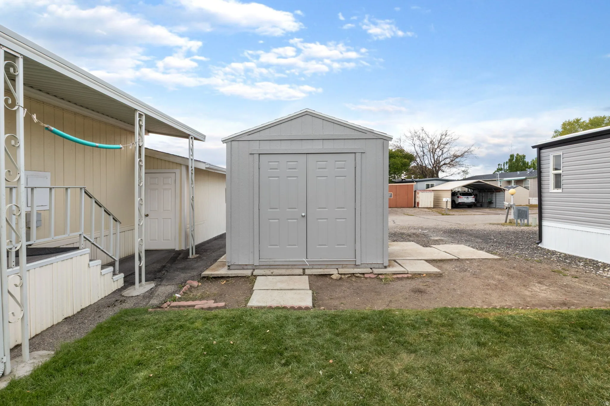 View of shed with a carport