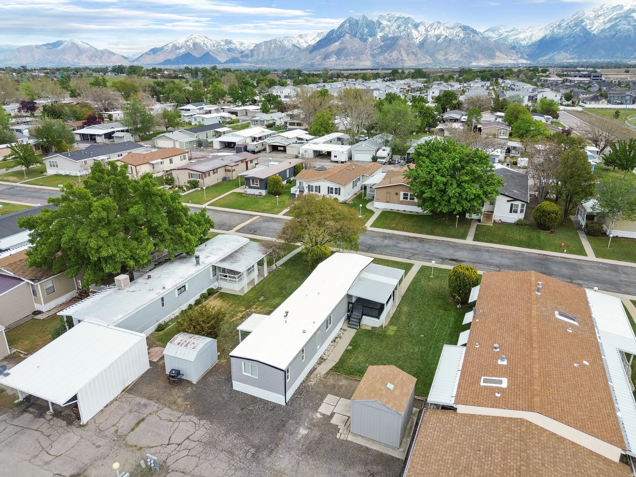 Aerial perspective of suburban area featuring a mountainous background
