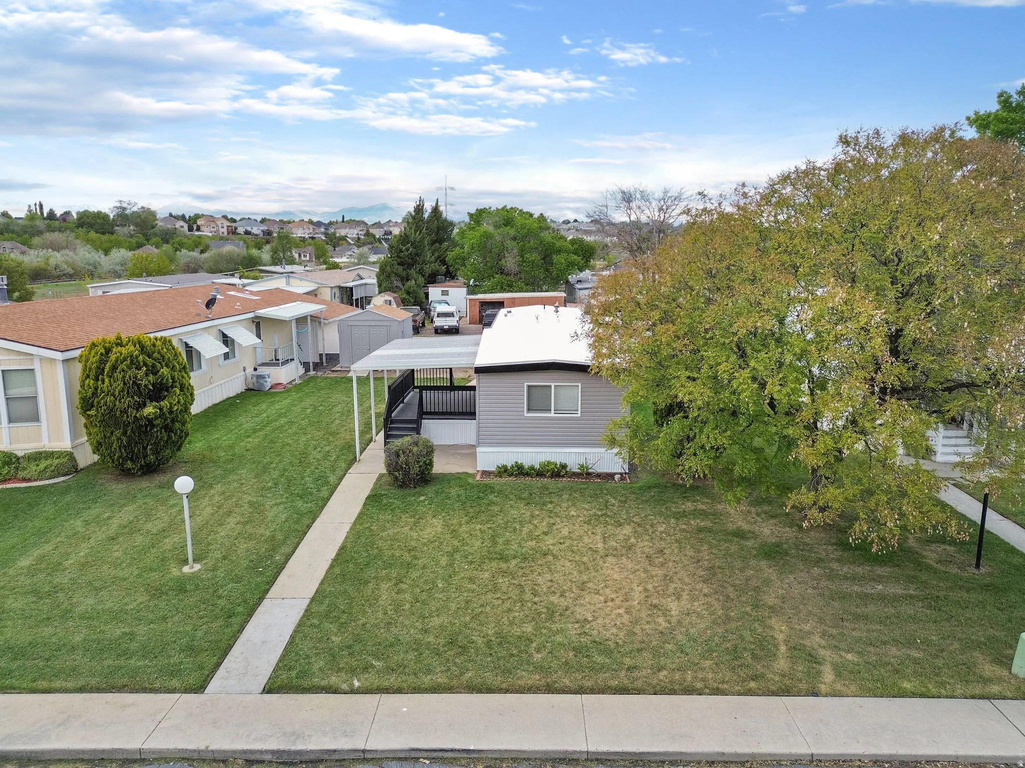 View of front of home featuring a front lawn and an area to practice putting