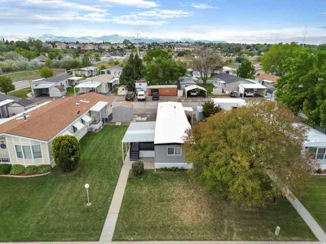 Aerial perspective of suburban area featuring a mountain backdrop