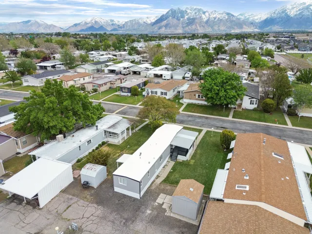 Aerial perspective of suburban area featuring a mountainous background