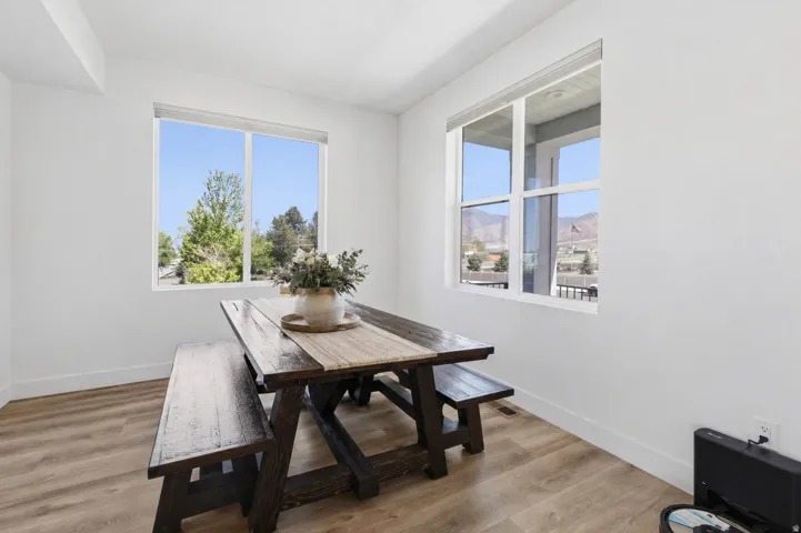 Dining space featuring light wood-style flooring and a mountain view
