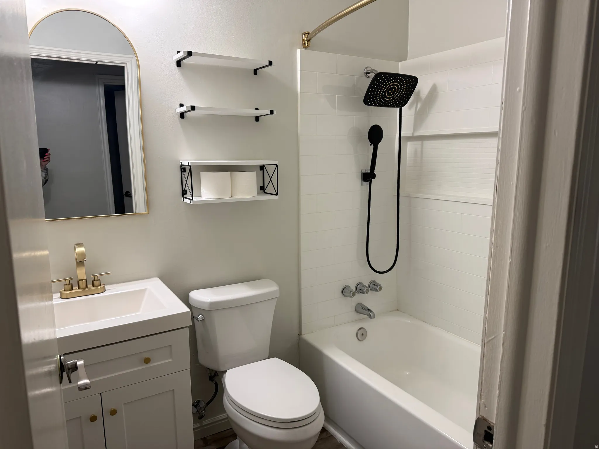 Bathroom featuring vanity and tub / shower combination