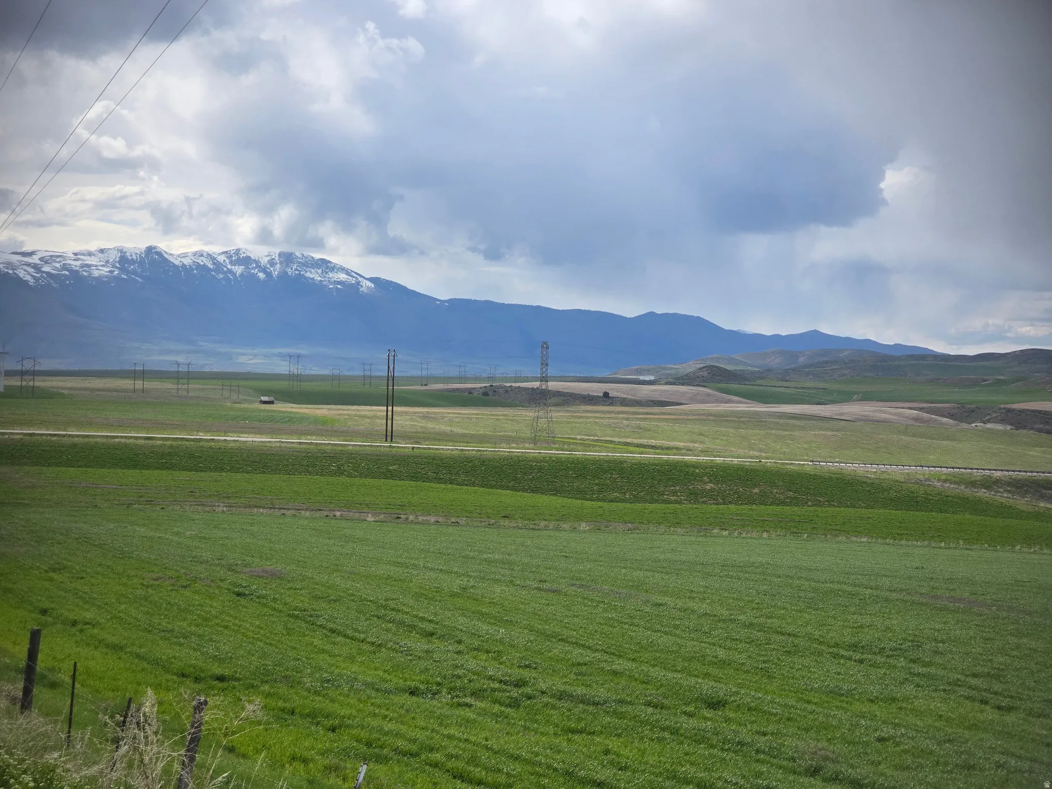 View of mountain background featuring rural landscape