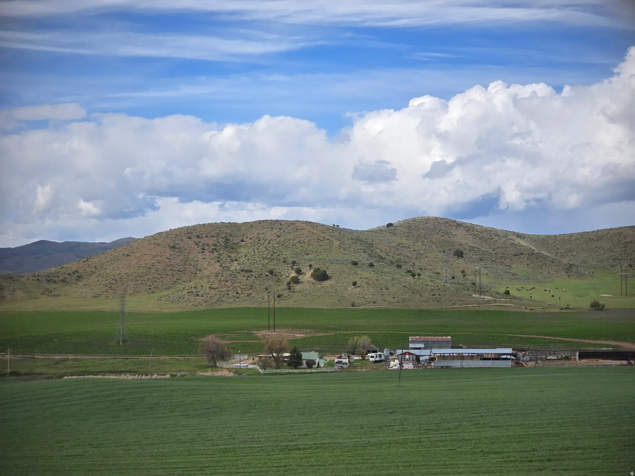 View of mountain backdrop featuring rural landscape