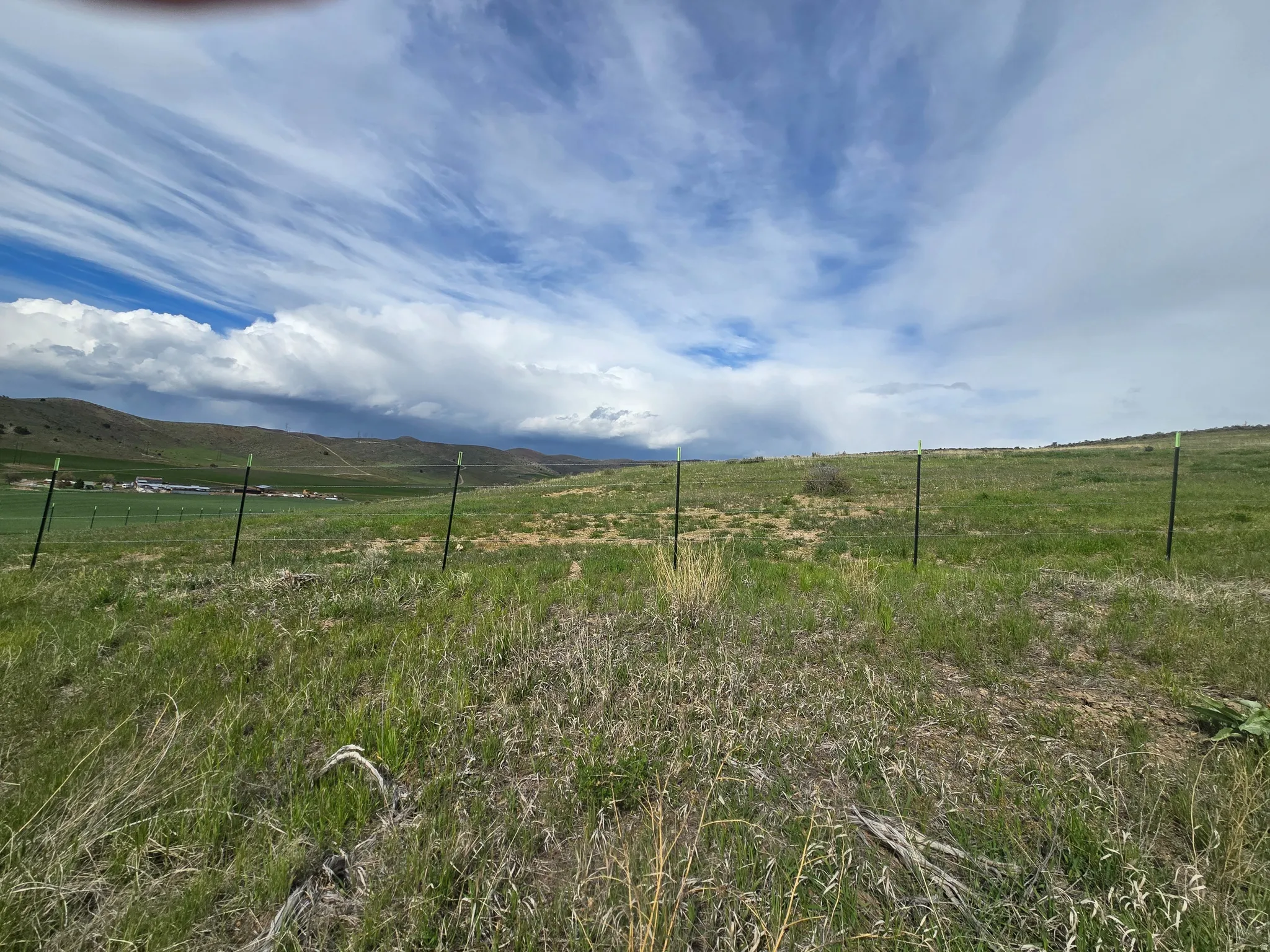 View of yard featuring a view of rural / pastoral area and a mountain view