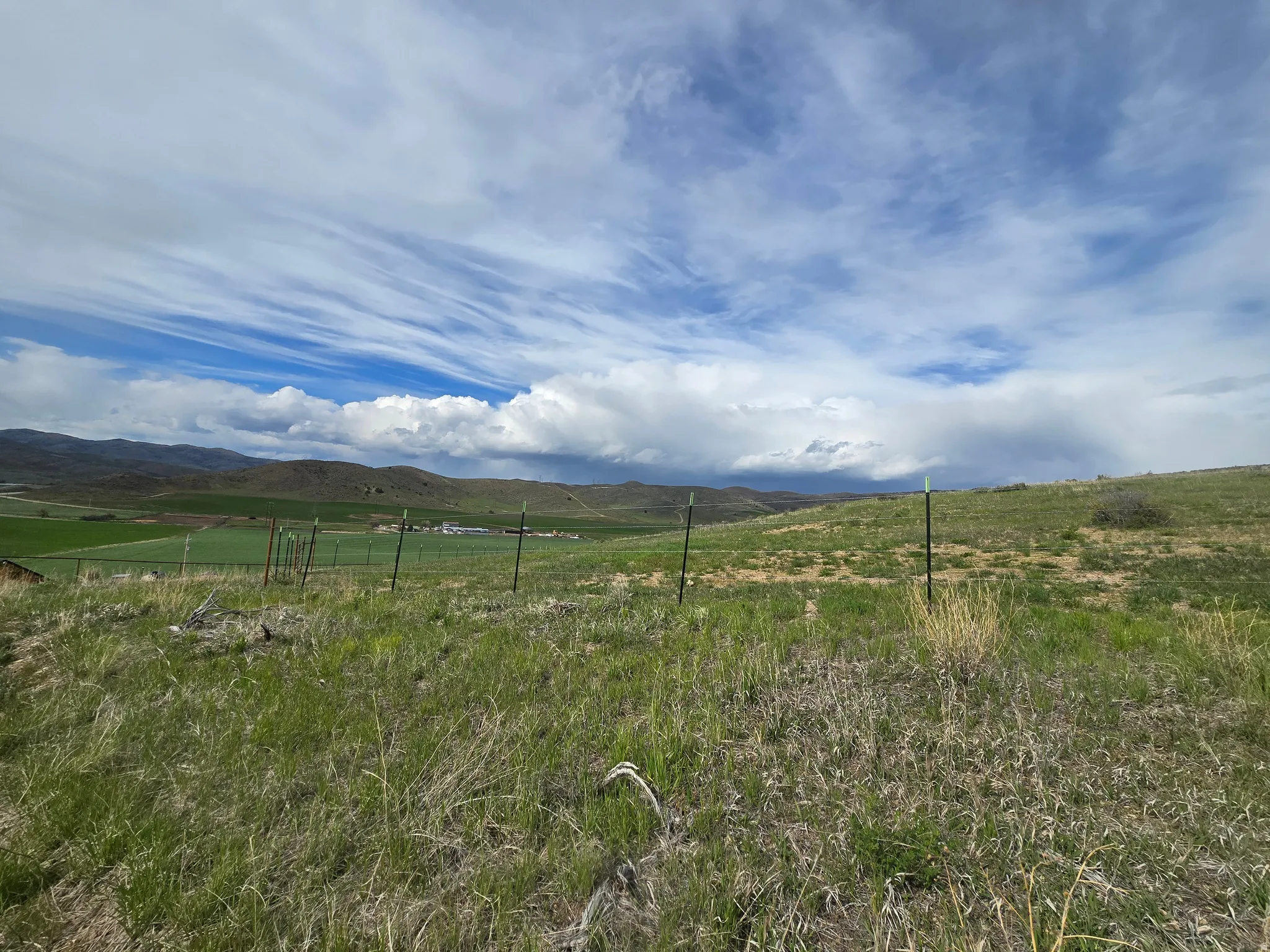 View of mountain backdrop with rural landscape