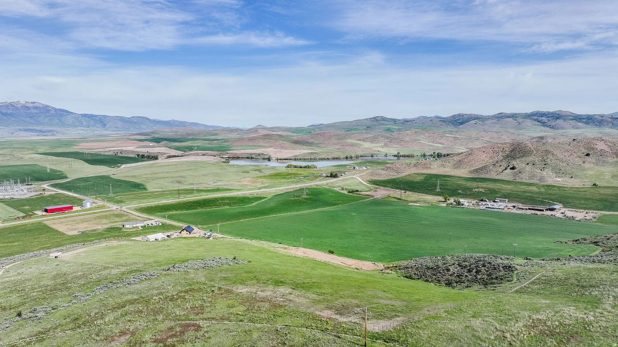 Expansive property featuring verdant fields and distant mountains