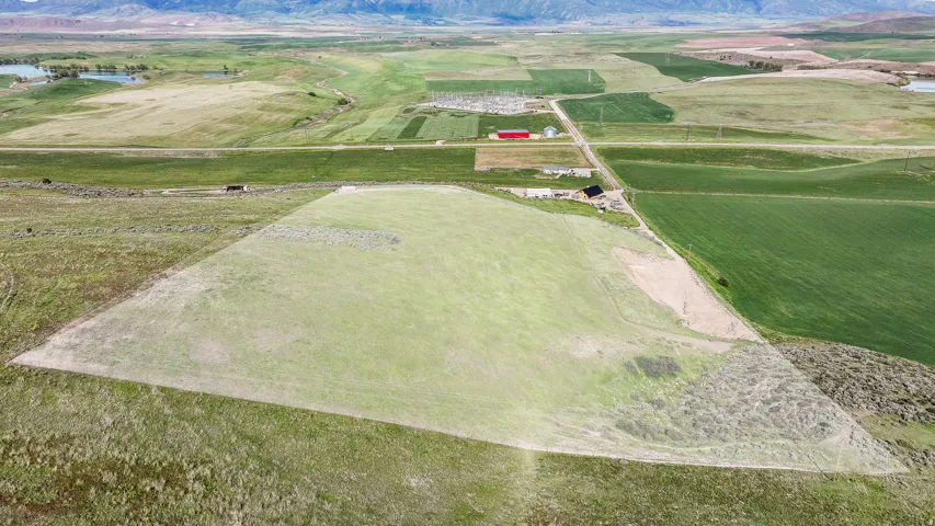 Expansive land parcel with surrounding agricultural fields