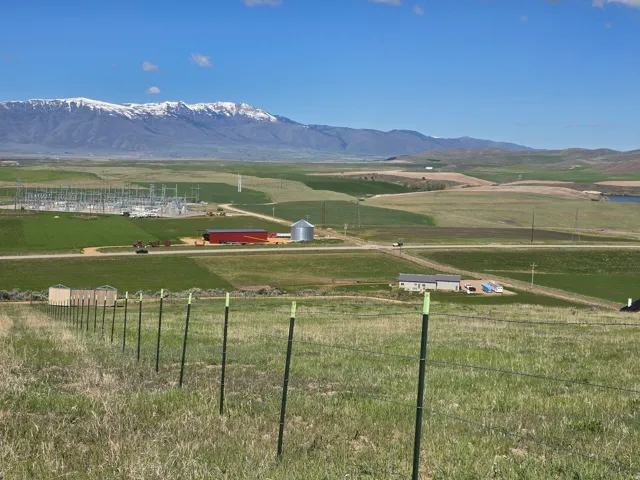 View of mountain background featuring rural landscape