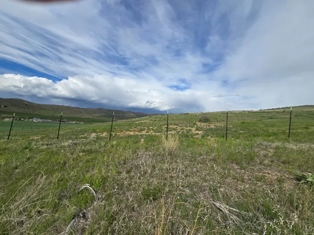 View of yard featuring a view of rural / pastoral area and a mountain view