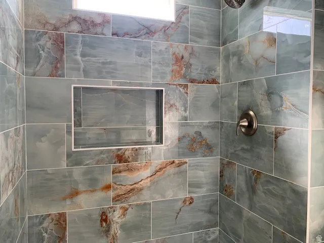 Jack & Jill Bathroom between two smaller bedrooms with a  beautiful tiled shower