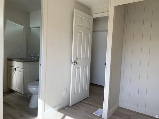 Jack & Jill Bathroom featuring vanity and light wood-style flooring