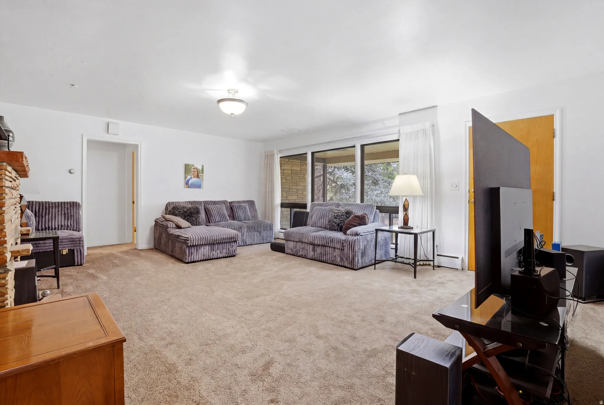 Living area with light colored carpet
