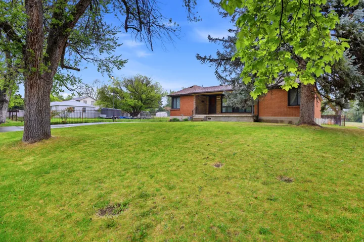 View of yard featuring covered porch