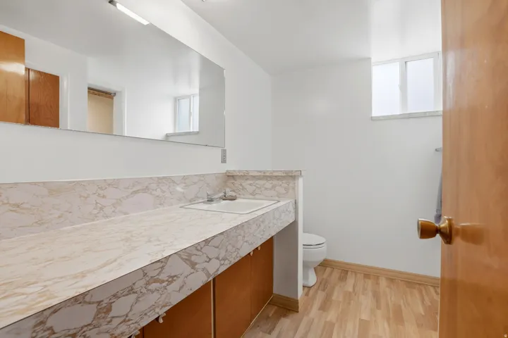Bathroom with vanity and light wood-type flooring