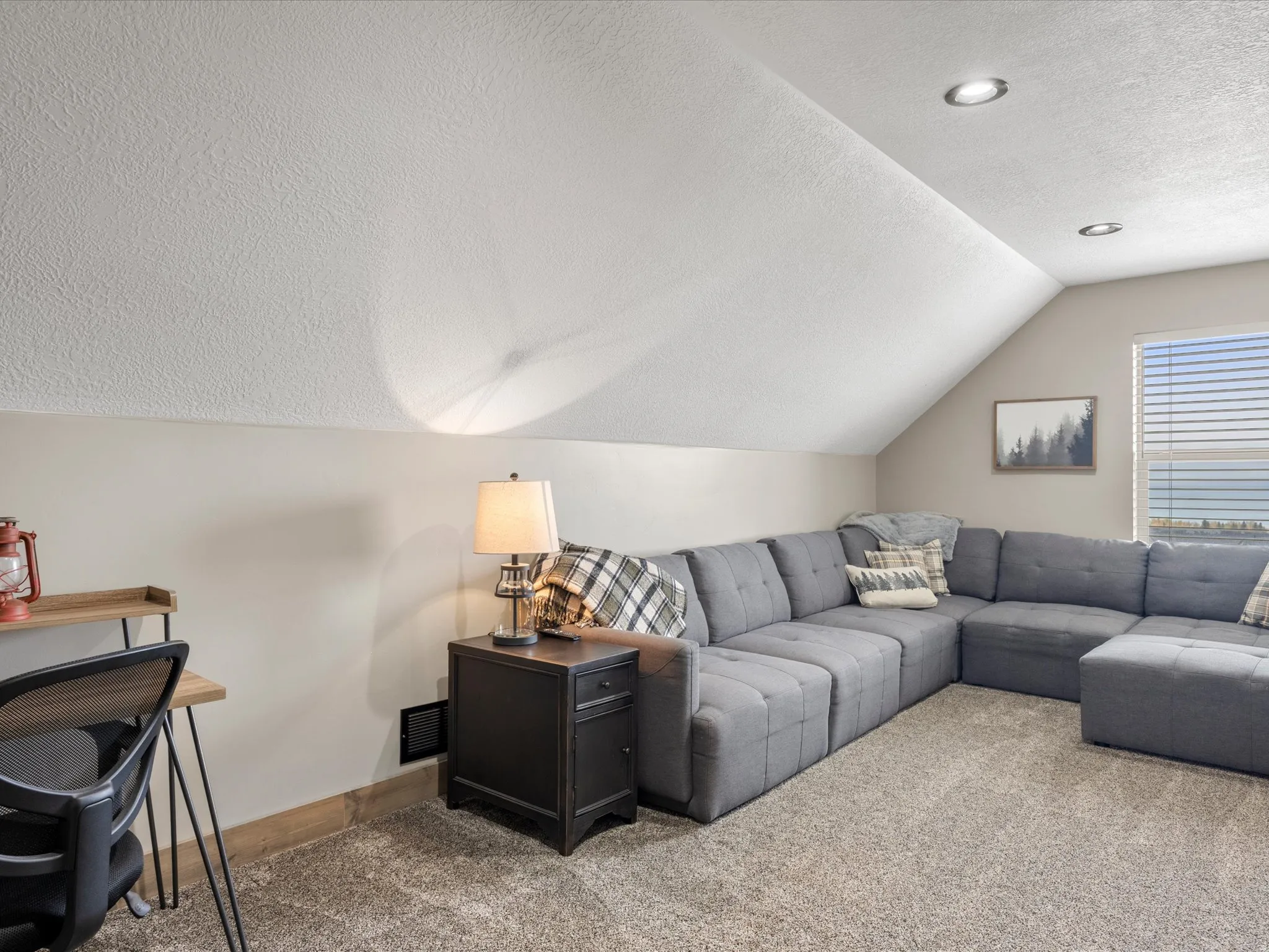 Living area with carpet flooring and baseboards