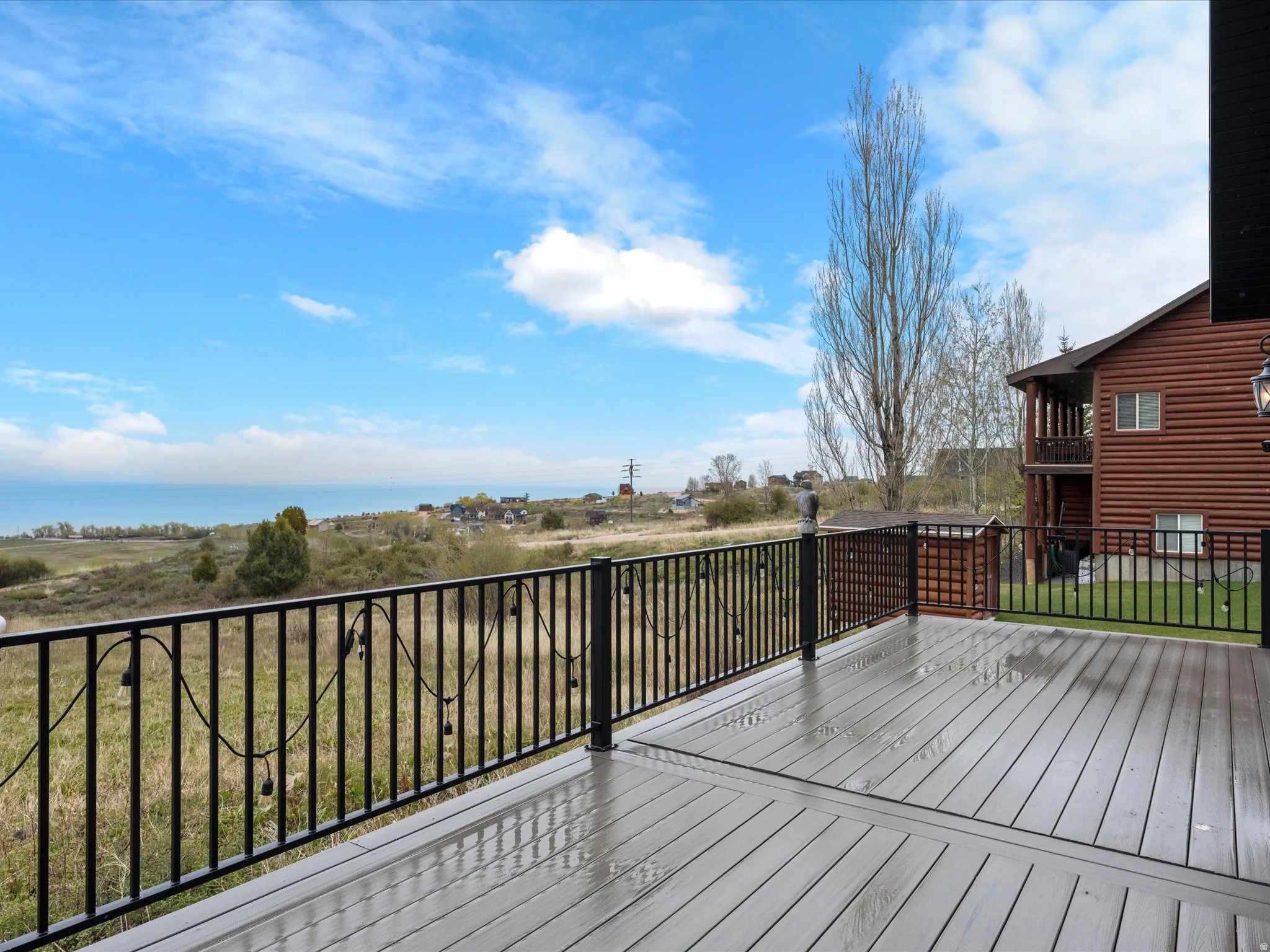 Wooden deck featuring a lawn