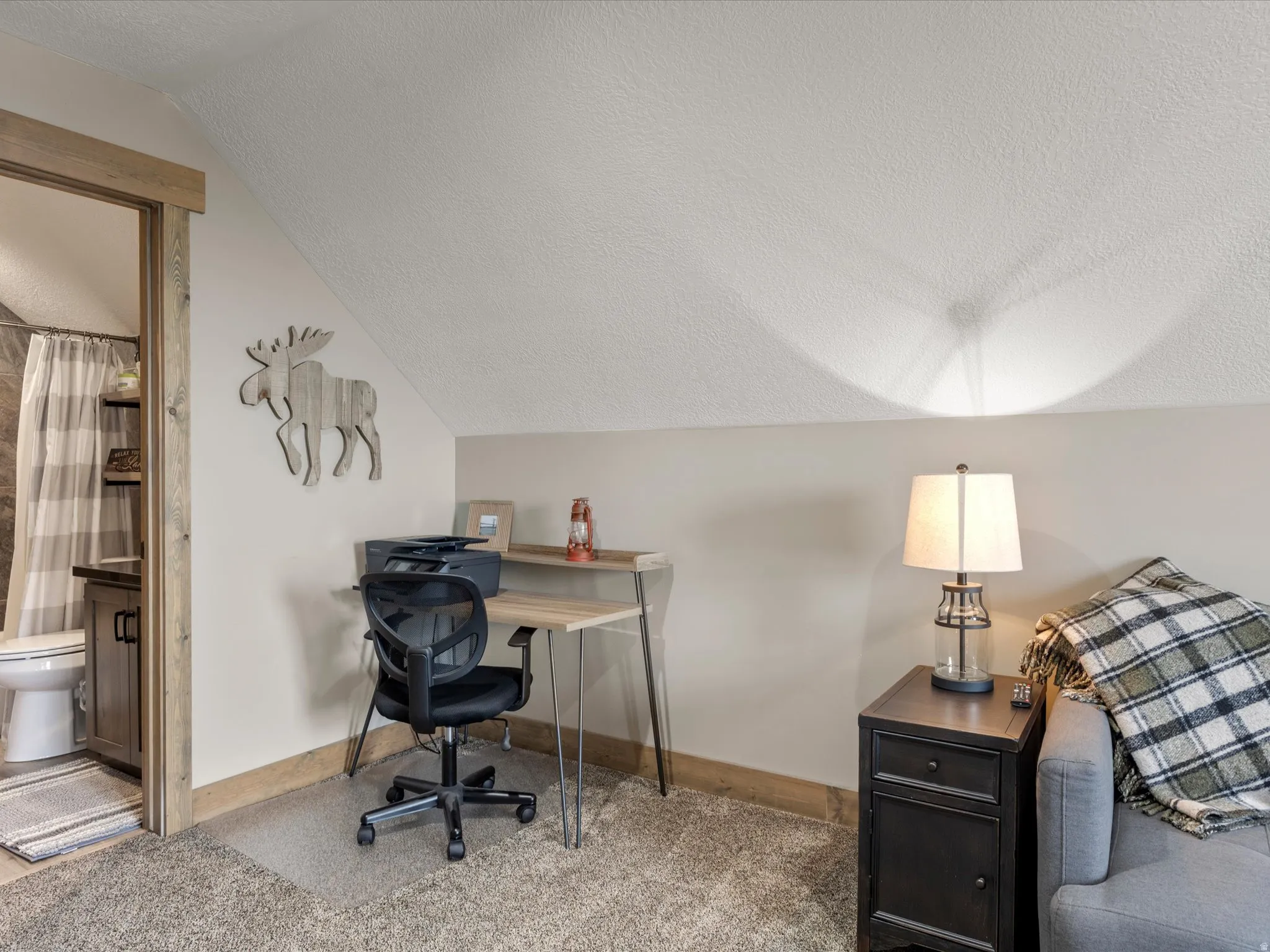 Office featuring carpet and baseboards