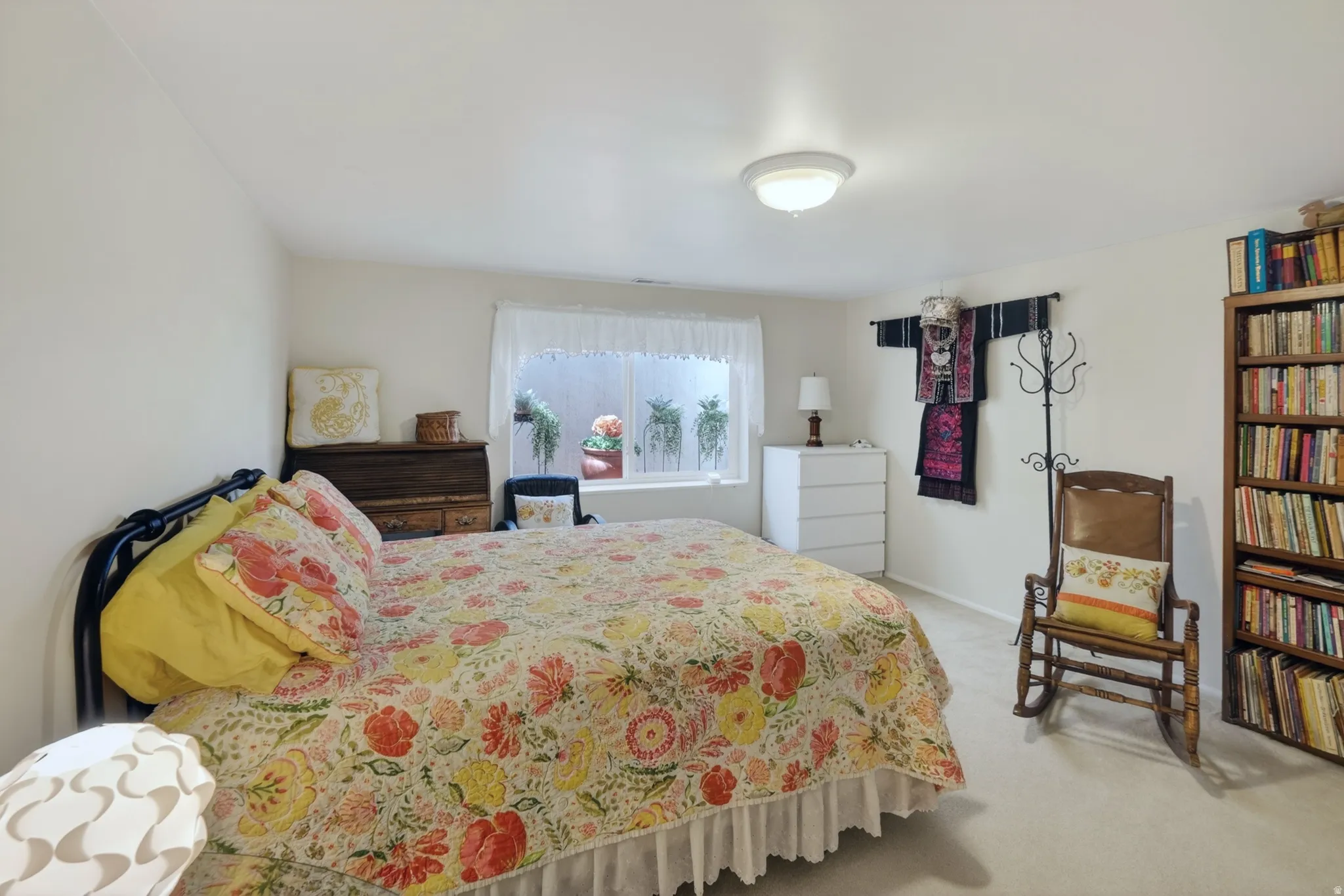 Bedroom with light colored carpet