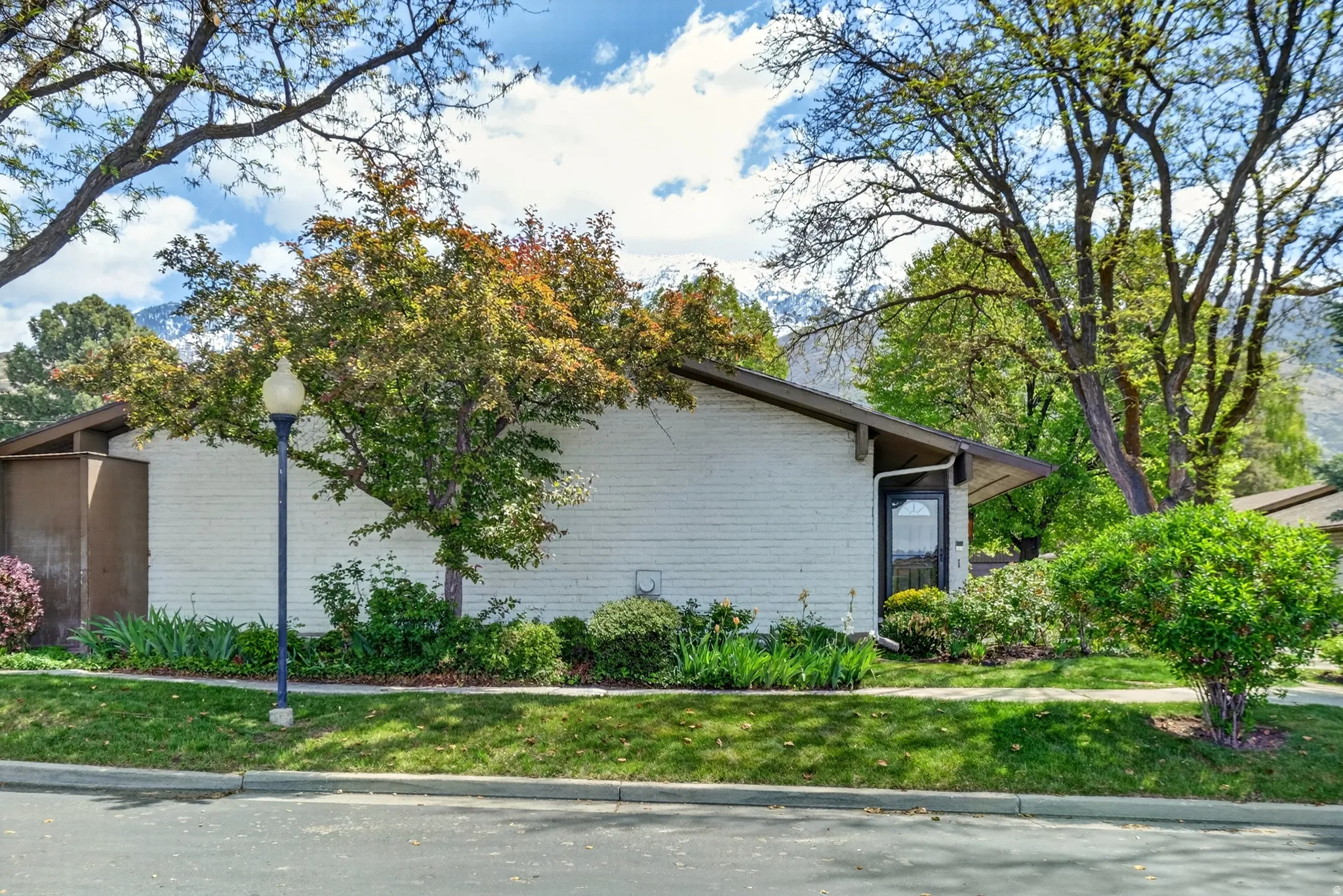 View of side of property featuring brick siding