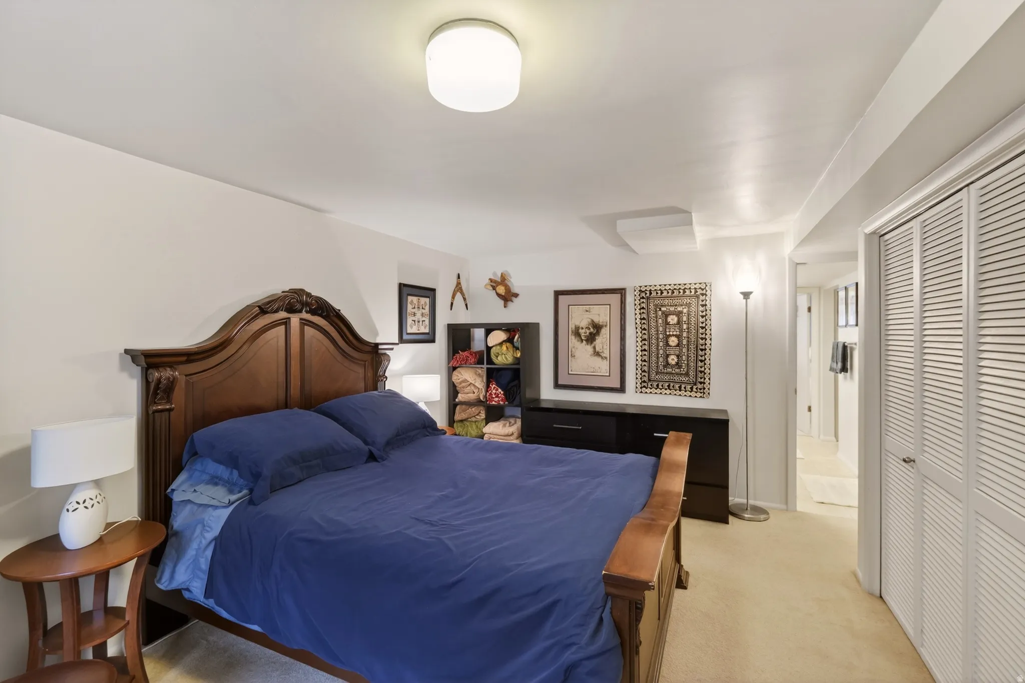 Bedroom featuring a closet and light carpet