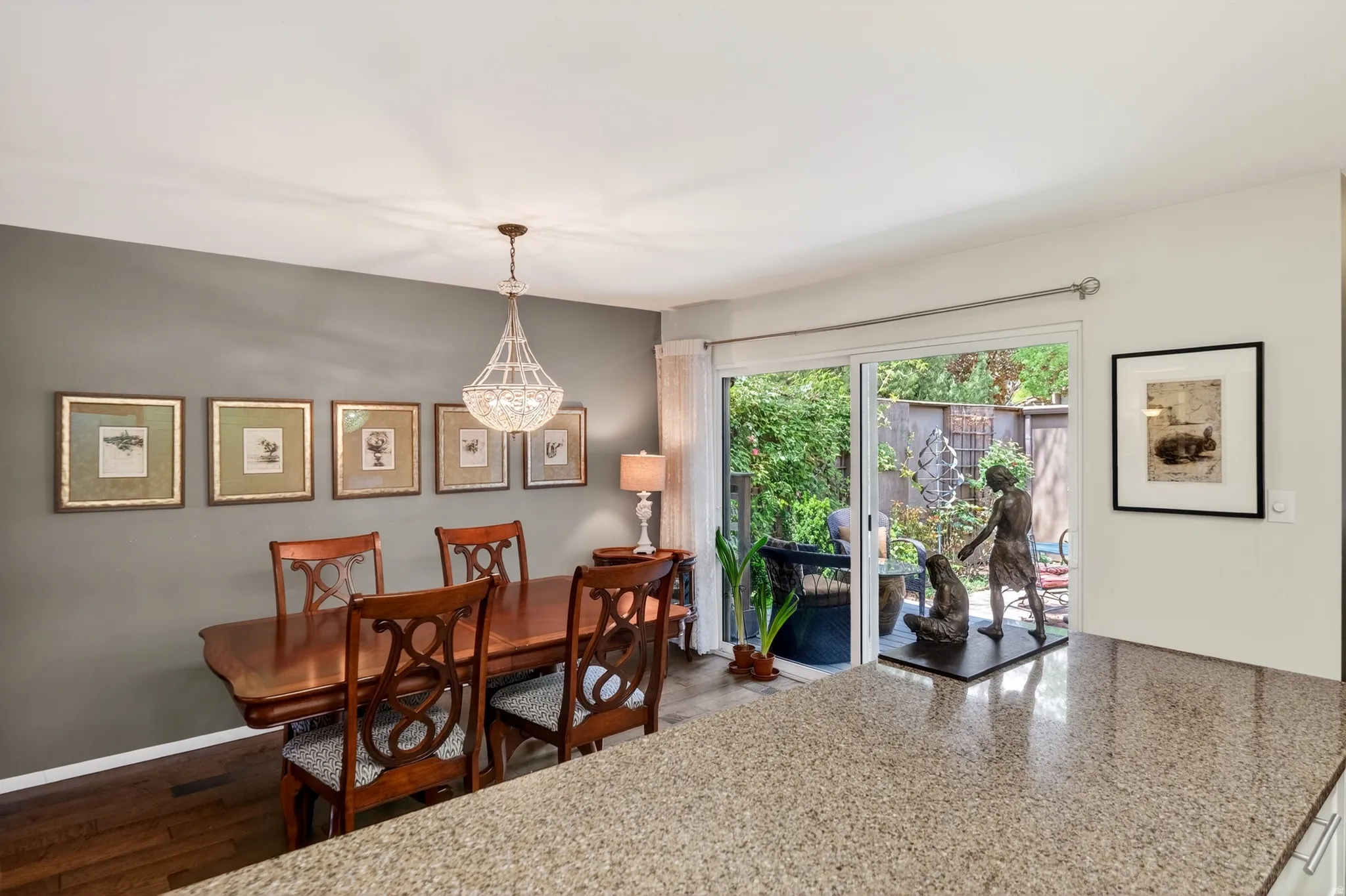 Dining room featuring wood finished floors and suspended lighting