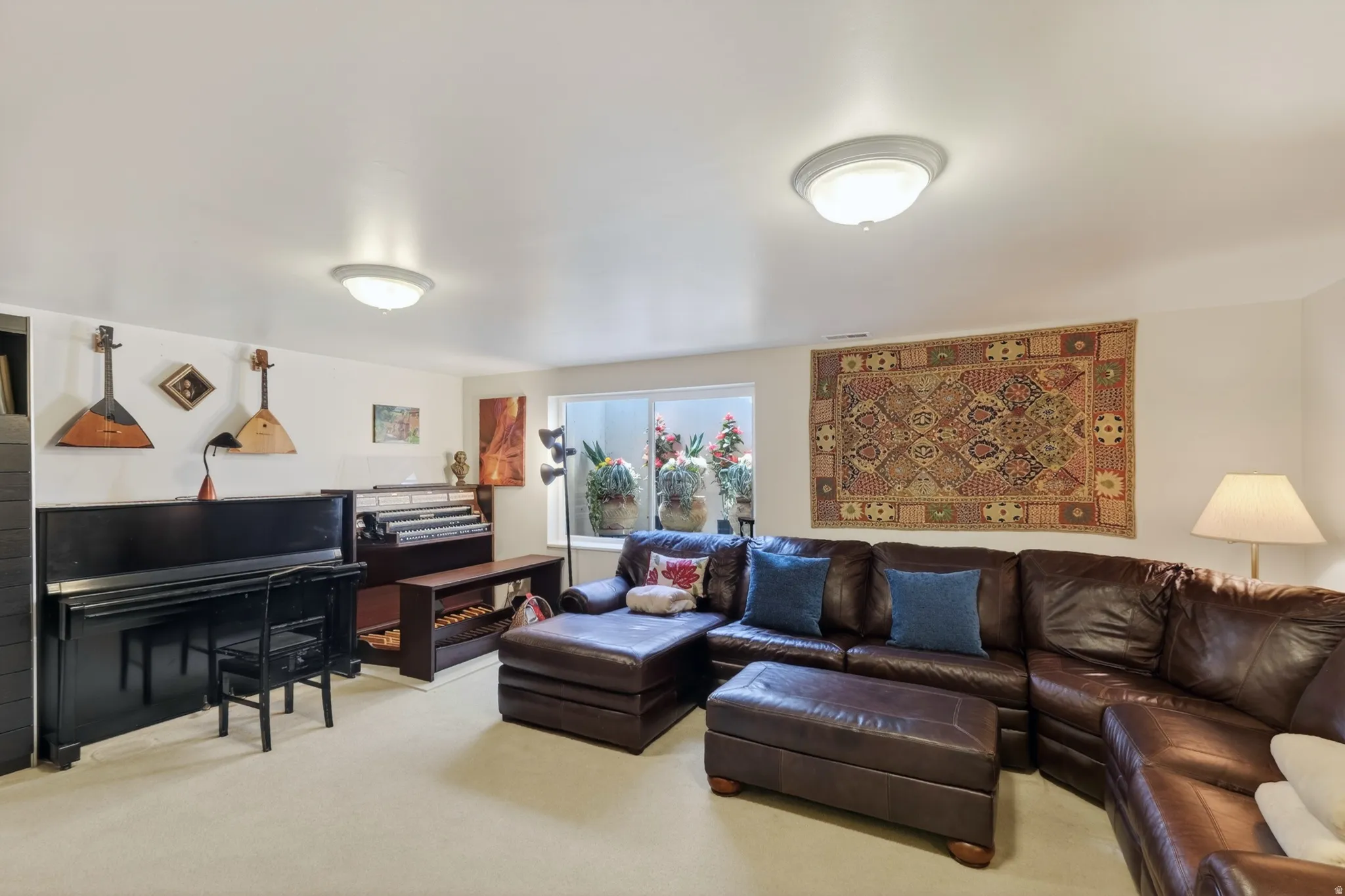 Living area with light colored carpet