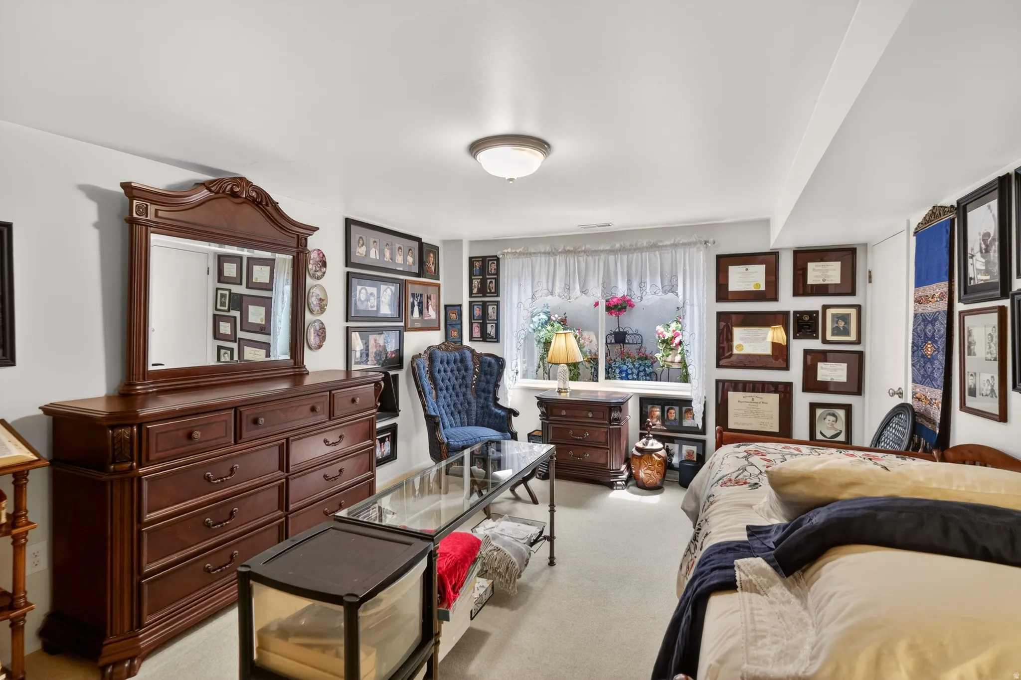 Bedroom featuring light carpet