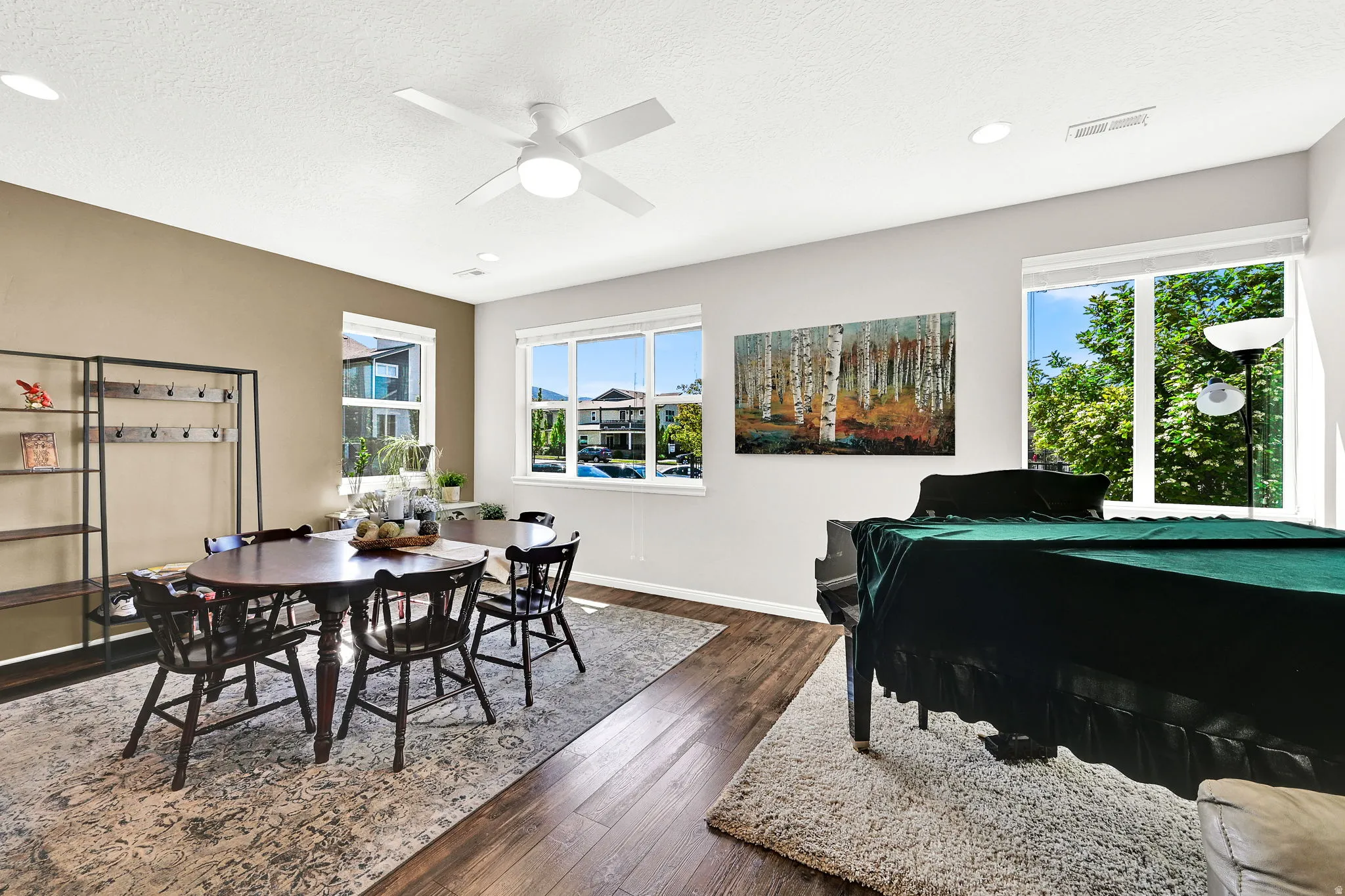 Another view of this multifunctional great room. Showing the healthy amount of natural light.