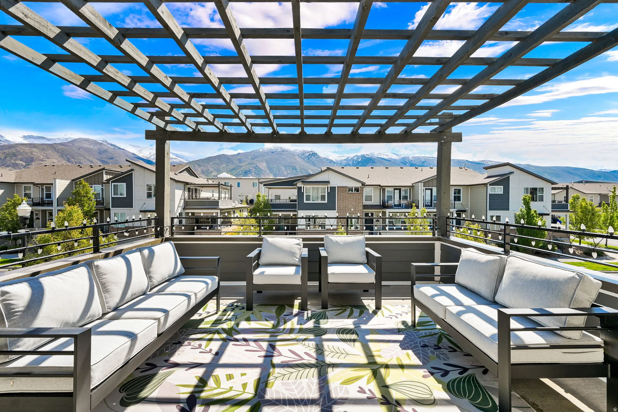 View of patio / terrace with outdoor lounge area, a mountain view, a residential view, and a pergola