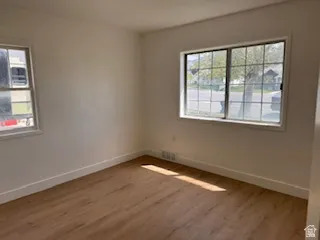Spare room featuring light wood-style floors