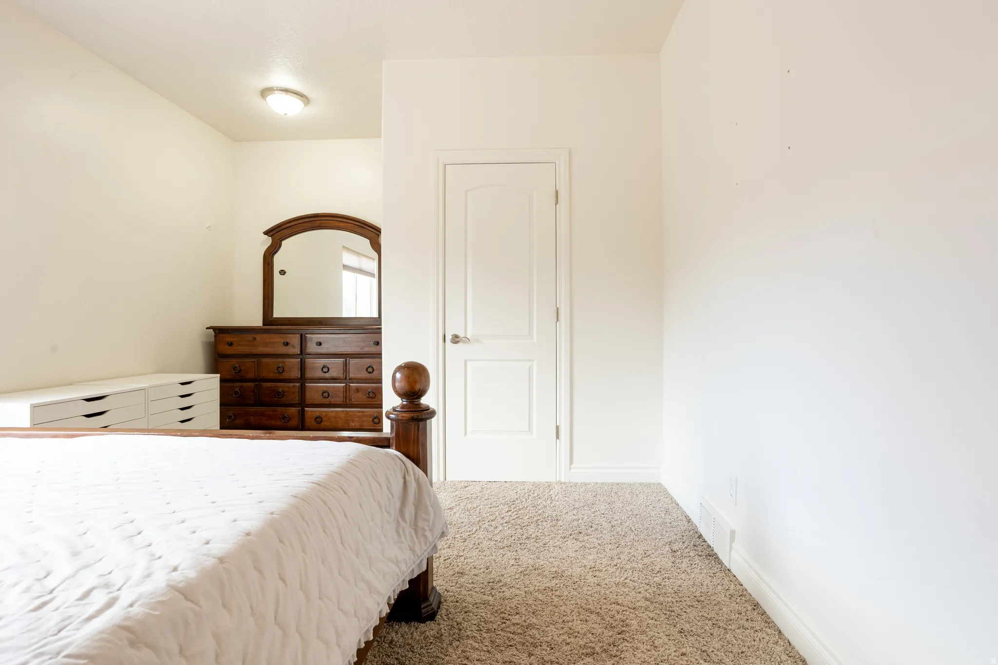 Bedroom with carpet flooring and baseboards