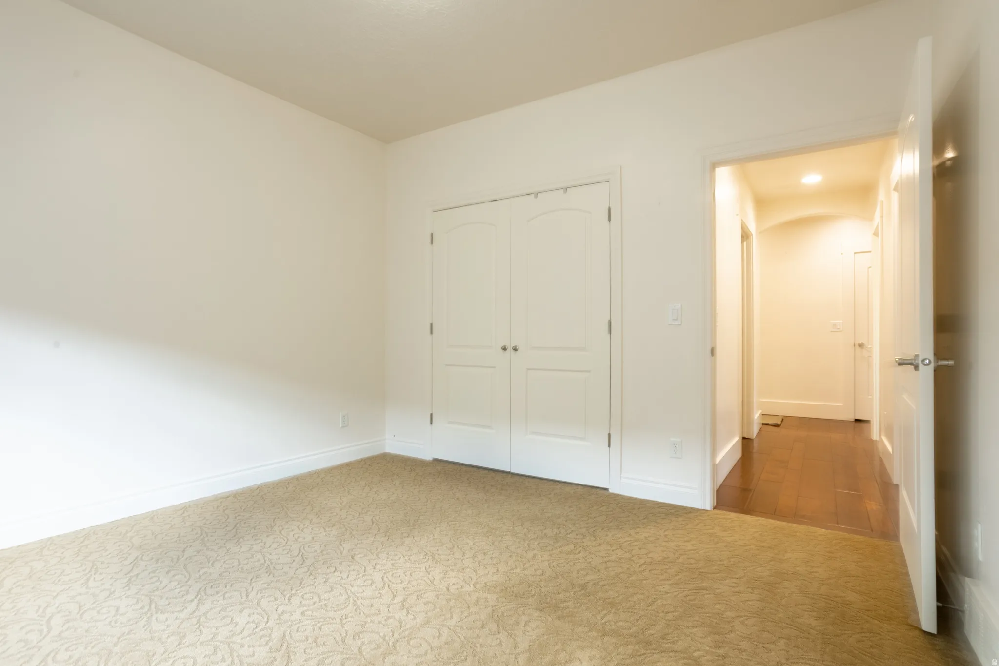 Unfurnished bedroom featuring carpet floors and a closet