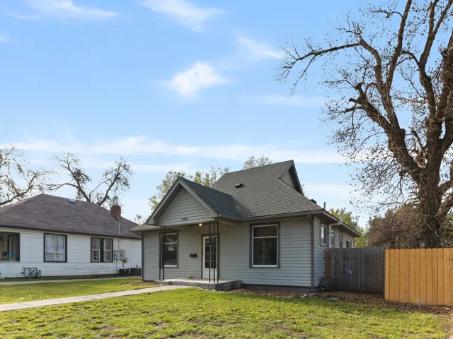 Bungalow featuring roof with shingles