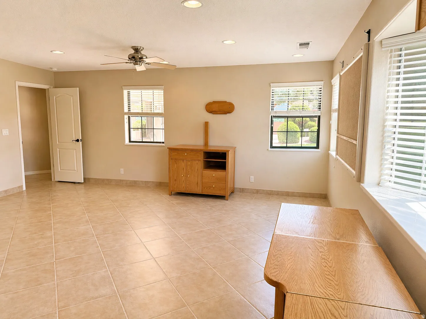Spare room featuring recessed lighting, light tile patterned flooring, and a ceiling fan