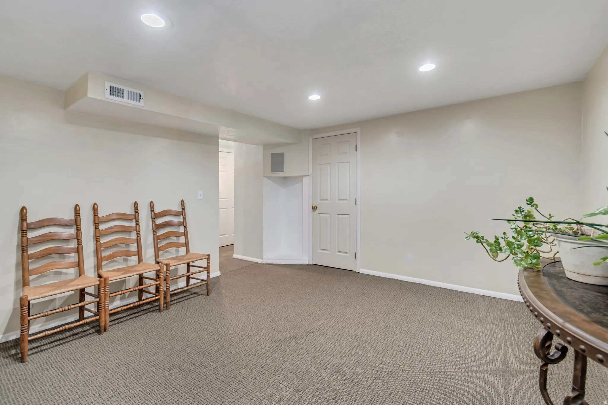 Spacious basement family/theater room.  Wired for sound and entertainment.  Also features carpeted floors and recessed lighting.
