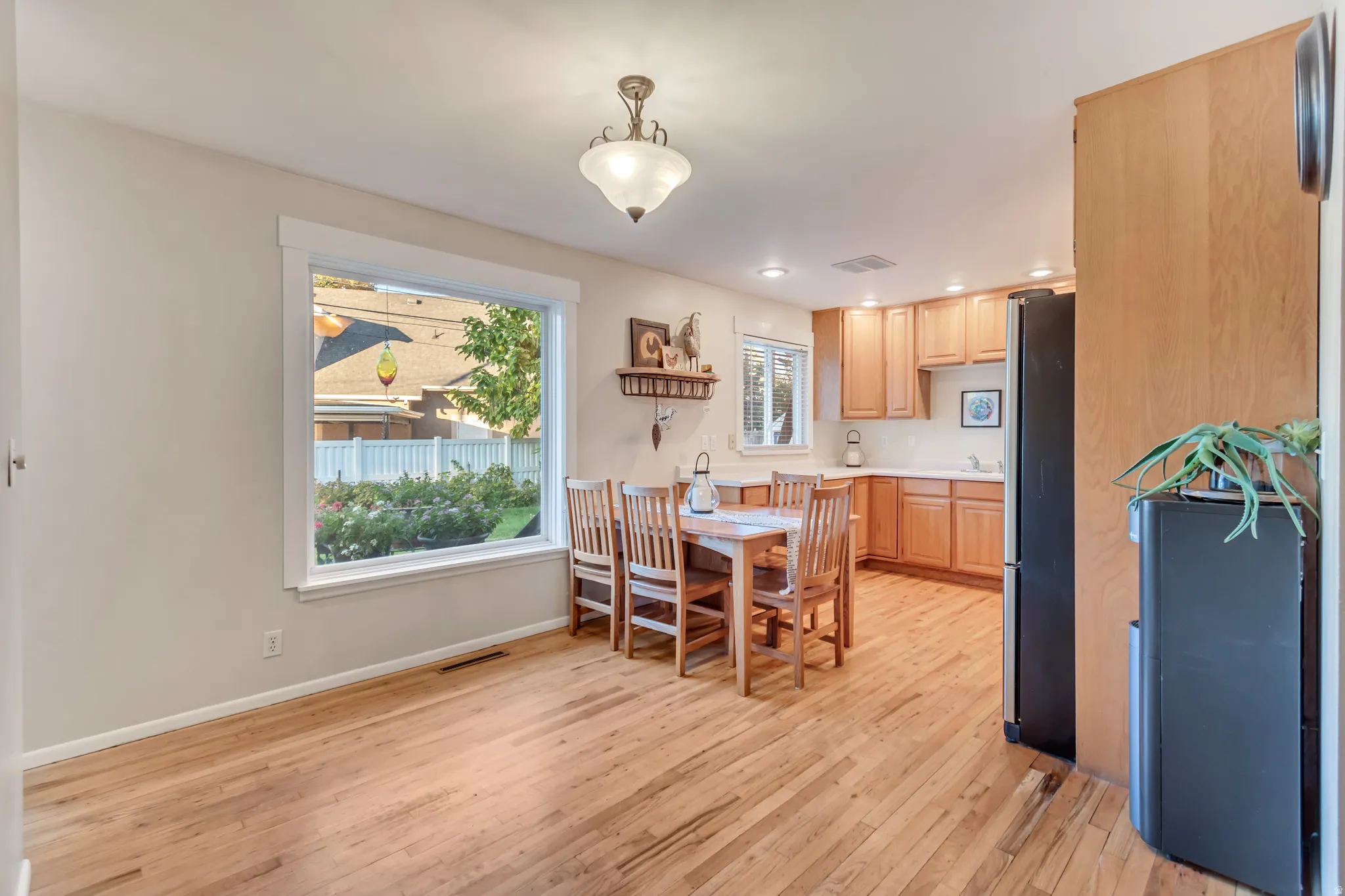 Bright and charming dining area that's flooded with light from the picture window.