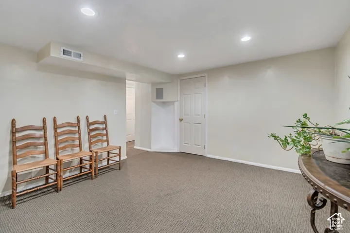Spacious basement family/theater room.  Wired for sound and entertainment.  Also features carpeted floors and recessed lighting.