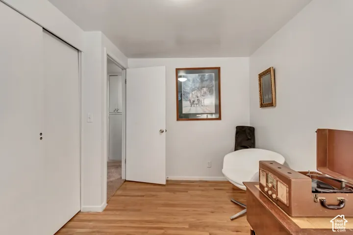 First guest bedroom upstairs, currently used as a home office. Original hardwood floors.