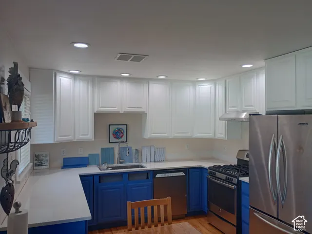 Fresh paint and colors on kitchen cabinets.  New canned lighting from above.  New stealth lighting underneath cabinetry,