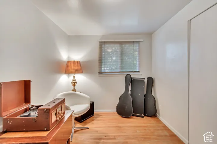 Second guest bedroom upstairs, currently used as a music room.  Original hardwood floors.