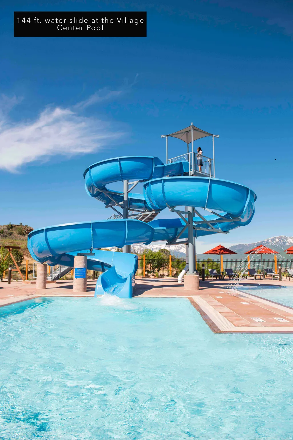 Community pool featuring a water slide